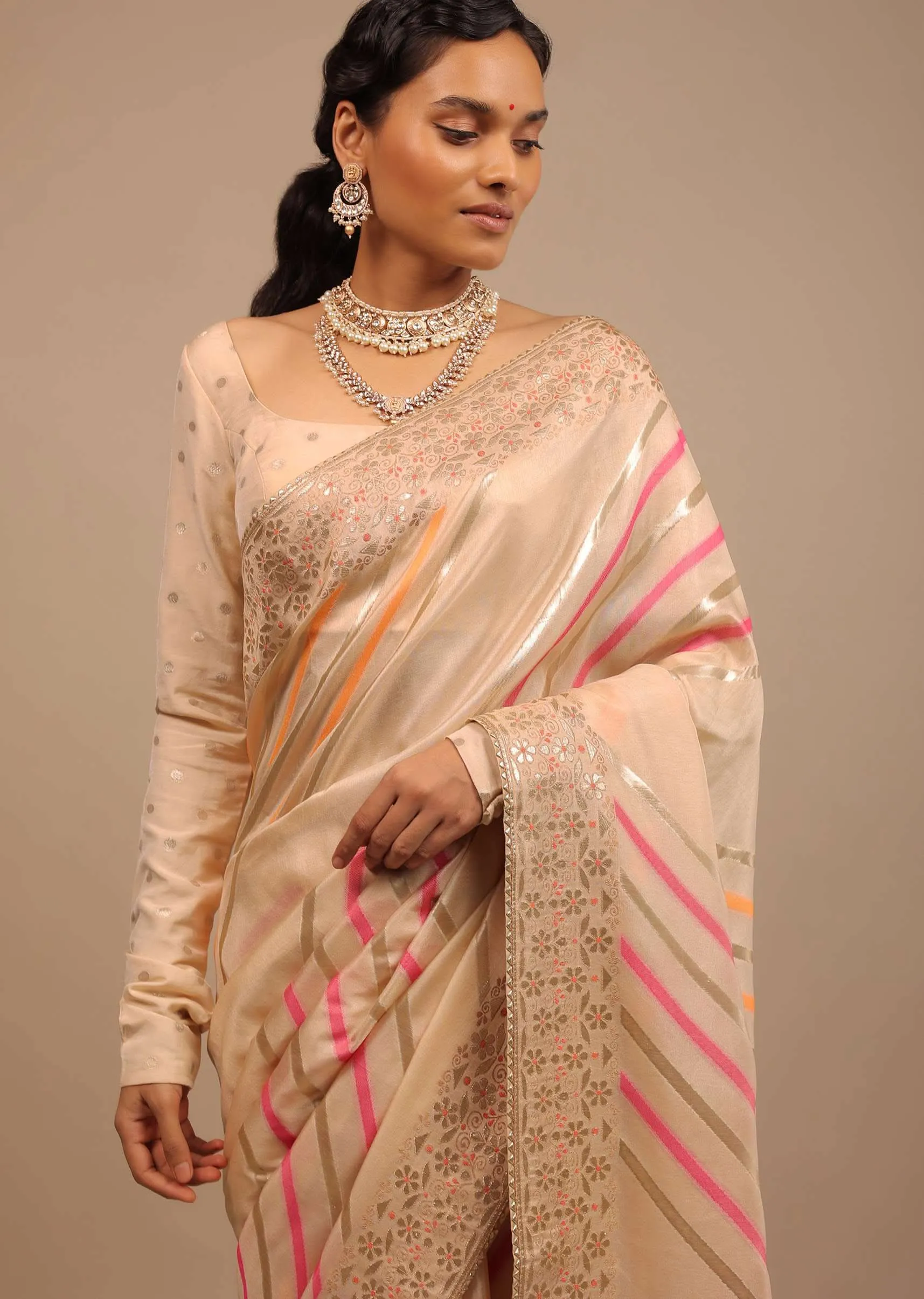 Cream Saree In Dola Silk With Multi Colored Woven Diagonal Stripes And Floral Border