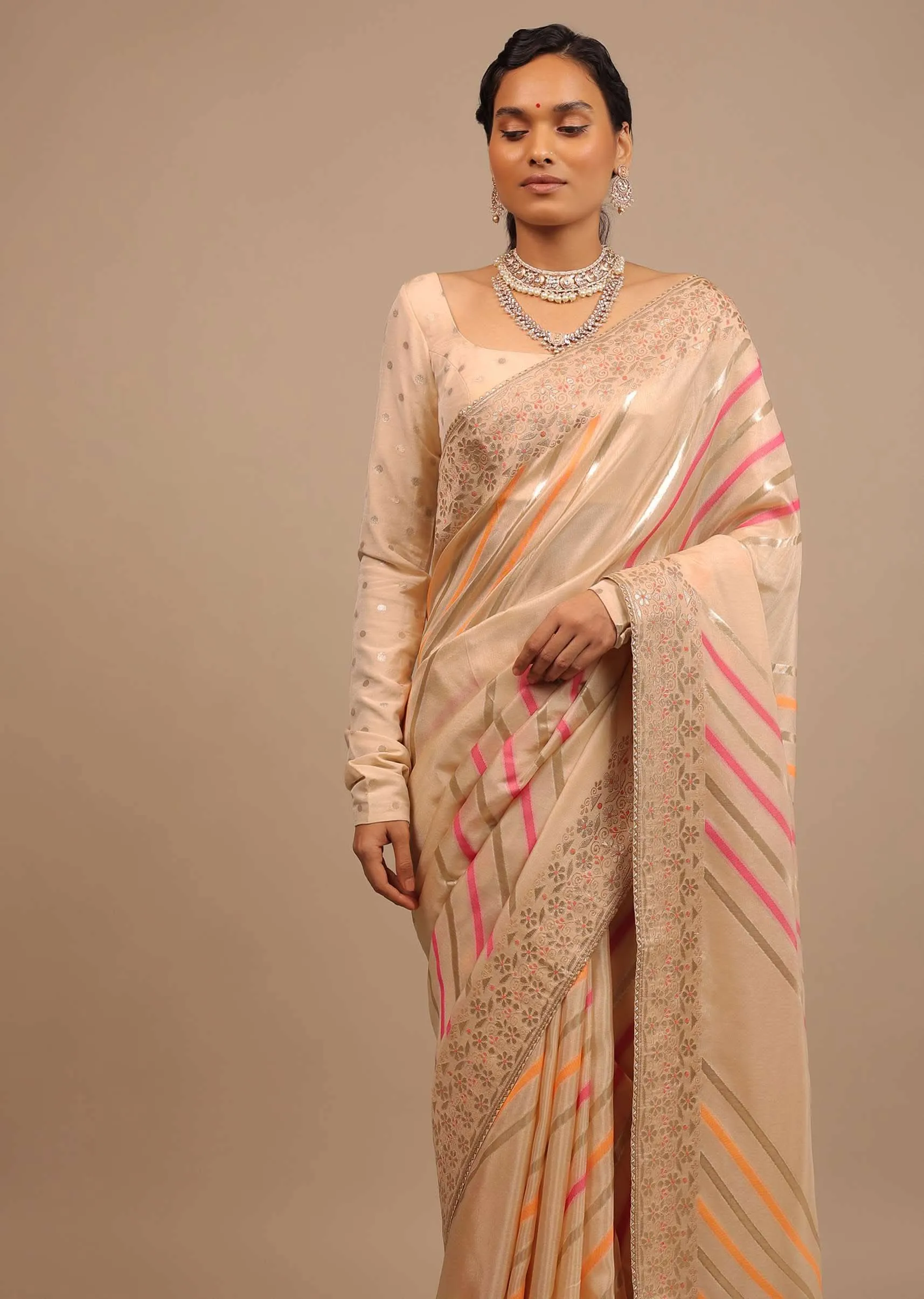 Cream Saree In Dola Silk With Multi Colored Woven Diagonal Stripes And Floral Border