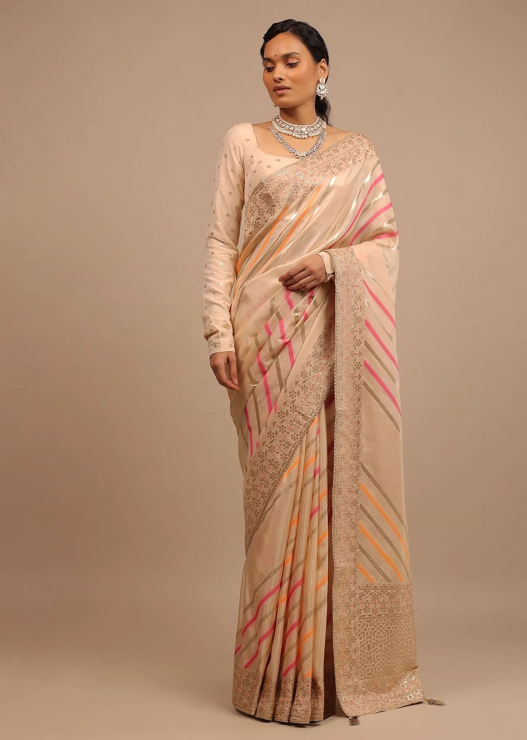 Cream Saree In Dola Silk With Multi Colored Woven Diagonal Stripes And Floral Border