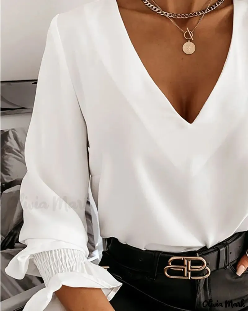 Deanwangkt - Long sleeve V-back top with criss-cross bead decor