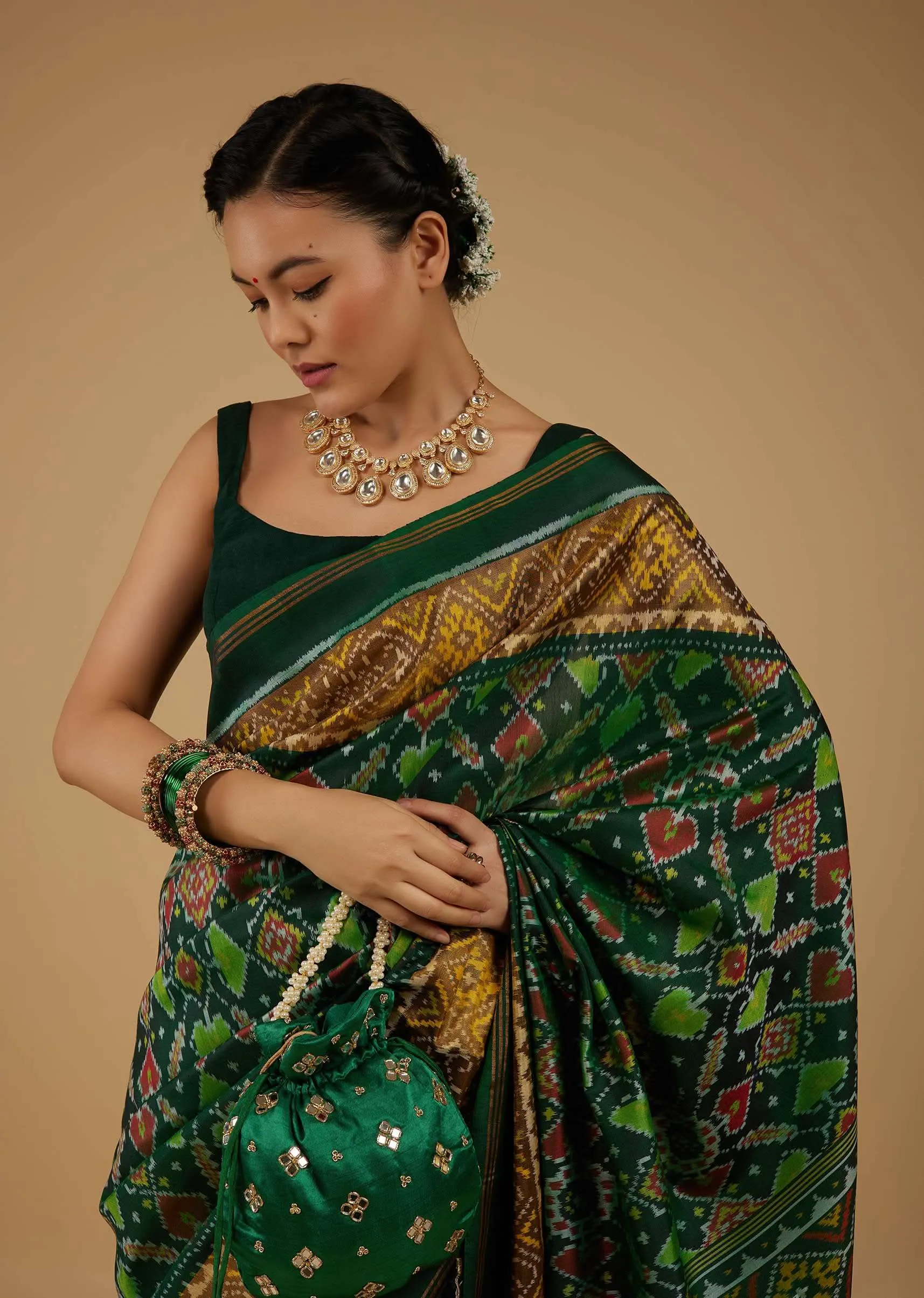 Deep Green Saree In Silk With Ikat Weave Patola Work